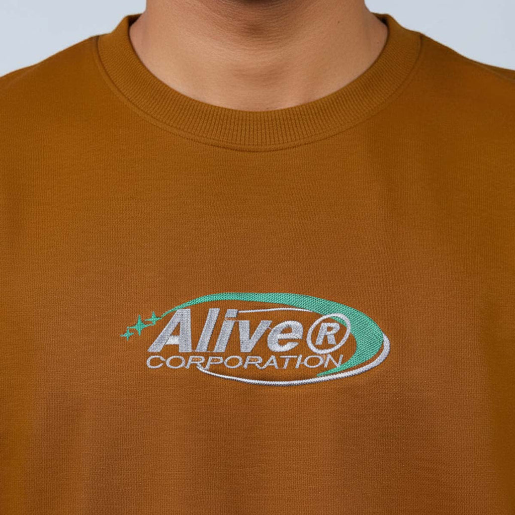 Camiseta Alive Oversized New Corporation Marrom